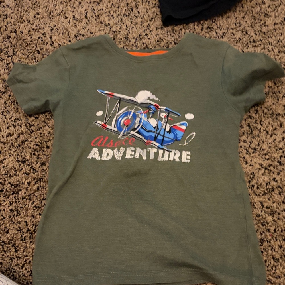 Green Graphic Tee with Airplane Design
